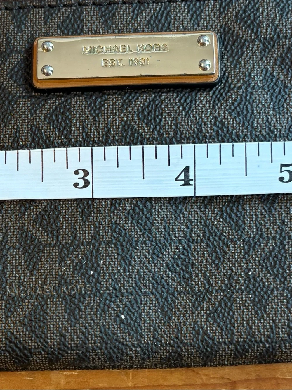 Michael Kors Brown and Tan Signature Wristlet with Gold Plate